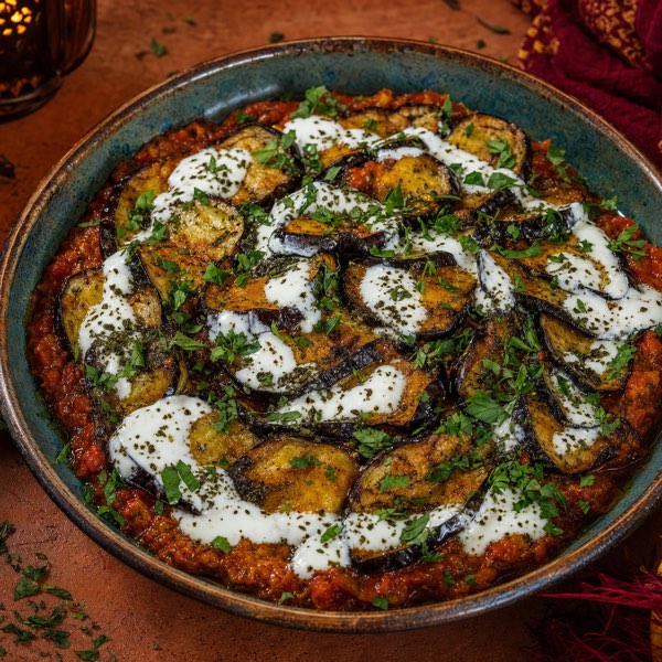 Banjan — fresh eggplant cooked with Afghan spices, topped with homemade mint yogurt